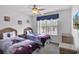 Charming bedroom with twin beds, Frozen themed bedding, and a bright window view at 4739 Cumbrian Lakes Dr, Kissimmee, FL 34746
