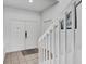 Bright foyer with staircase leading to the upper level, featuring clean lines and neutral tones at 4739 Cumbrian Lakes Dr, Kissimmee, FL 34746