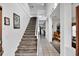 Spacious foyer with a staircase and view into the dining area, offering an inviting entrance at 4739 Cumbrian Lakes Dr, Kissimmee, FL 34746