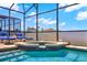 Relaxing pool and spa with lounge chairs, perfect for enjoying sunny days at 4739 Cumbrian Lakes Dr, Kissimmee, FL 34746