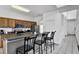 Bright kitchen with bar seating, stainless steel appliances, and an open layout at 4739 Cumbrian Lakes Dr, Kissimmee, FL 34746