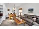Cozy living room and dining area featuring comfortable seating, neutral colors, and warm lighting at 4739 Cumbrian Lakes Dr, Kissimmee, FL 34746