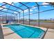 Sparkling pool and spa surrounded by a screened enclosure and beautiful landscaping at 4739 Cumbrian Lakes Dr, Kissimmee, FL 34746