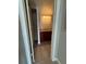 Bathroom features dark wood cabinets, granite countertop, and a closet for storage at 5160 Conroy Rd # 26, Orlando, FL 32811