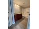 Well-lit bathroom boasts dark wood cabinetry with granite countertop and shower/tub combo at 5160 Conroy Rd # 26, Orlando, FL 32811
