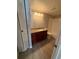 Well-lit bathroom boasts dark wood cabinetry with granite countertop and shower/tub combo at 5160 Conroy Rd # 26, Orlando, FL 32811