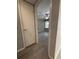 Bedroom view highlighting wood-look floors, fan, and natural light from windows at 5160 Conroy Rd # 26, Orlando, FL 32811