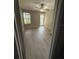 Bedroom with wood-look floors, ceiling fan and a glass door leading to the outdoors at 5160 Conroy Rd # 26, Orlando, FL 32811