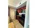 Well-equipped kitchen with stainless steel appliances, granite counters, and wood cabinets at 5160 Conroy Rd # 26, Orlando, FL 32811
