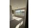 Bright laundry room with wood-look flooring and large windows for ample natural light at 5160 Conroy Rd # 26, Orlando, FL 32811
