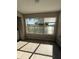 Sunlit laundry room with large windows and wood-look flooring at 5160 Conroy Rd # 26, Orlando, FL 32811