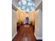 Elegant lobby featuring a rotunda with a chandelier, ornate decor, and a wood floor at 5160 Conroy Rd # 26, Orlando, FL 32811