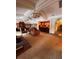 Community lounge with comfortable seating, elegant chandeliers, and a bar area at 5160 Conroy Rd # 26, Orlando, FL 32811