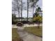 Community picnic area with tables overlooking a pond, perfect for outdoor relaxation and gatherings at 5160 Conroy Rd # 26, Orlando, FL 32811