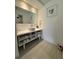 Bright bathroom with a modern vessel sink and under-sink storage at 5245 W Irlo Bronson Memorial Hwy # 276, Kissimmee, FL 34746