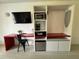 The bedroom includes a desk, minibar, and wardrobe for convenience at 5245 W Irlo Bronson Memorial Hwy # 276, Kissimmee, FL 34746