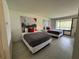 Inviting bedroom with comfy beds, minimalist decor, and exterior views at 5245 W Irlo Bronson Memorial Hwy # 276, Kissimmee, FL 34746