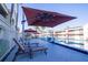 Relaxing poolside view with lounge chairs, umbrellas, and lush palm trees at 5245 W Irlo Bronson Memorial Hwy # 276, Kissimmee, FL 34746