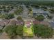 Aerial view of backyard with property lines, lawn, patio, and tree coverage at 5321 Los Palma Vista Dr, Orlando, FL 32837