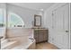 Bright bathroom featuring a soaking tub, granite vanity, and tiled floors at 5321 Los Palma Vista Dr, Orlando, FL 32837