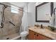 Bathroom featuring a walk-in shower with marble tile and granite countertops with a sink at 5321 Los Palma Vista Dr, Orlando, FL 32837
