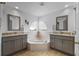 Elegant bathroom with dual sinks, granite countertops, and a corner soaking tub for ultimate relaxation at 5321 Los Palma Vista Dr, Orlando, FL 32837