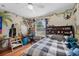 bedroom featuring a twin bed and natural themed mural on the walls at 5321 Los Palma Vista Dr, Orlando, FL 32837