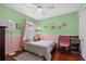 bedroom featuring a twin bed and pink accent colors at 5321 Los Palma Vista Dr, Orlando, FL 32837