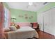 bedroom featuring a twin bed and pink accent colors at 5321 Los Palma Vista Dr, Orlando, FL 32837
