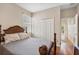 Comfortable bedroom with wood floors, closet and a tranquil view of the hallway at 5321 Los Palma Vista Dr, Orlando, FL 32837