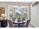 Bright breakfast nook with a round table situated by a large bay window, offering plenty of natural light at 5321 Los Palma Vista Dr, Orlando, FL 32837