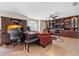 Inviting living room with custom built-ins and a large desk area, perfect for work and relaxation at 5321 Los Palma Vista Dr, Orlando, FL 32837