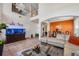 Open-concept living area with high ceilings, modern decor, and tile flooring throughout at 5321 Los Palma Vista Dr, Orlando, FL 32837