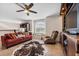 Spacious living room with a cozy seating area, built-in entertainment center, and abundant natural light at 5321 Los Palma Vista Dr, Orlando, FL 32837