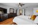 Bright main bedroom boasting hardwood floors, an entertainment area, and a peaceful atmosphere at 5321 Los Palma Vista Dr, Orlando, FL 32837