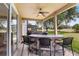 Covered outdoor bar area with seating and ceiling fan at 5321 Los Palma Vista Dr, Orlando, FL 32837