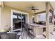 Covered patio with tile flooring, bar, ceiling fan, and sliding glass doors at 5321 Los Palma Vista Dr, Orlando, FL 32837