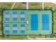 Aerial view of a community tennis court with a blue and green surface at 5321 Los Palma Vista Dr, Orlando, FL 32837
