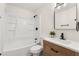 Modern bathroom with a tub-shower combo, stylish vanity, updated fixtures, and neutral finishes at 620 Plum Ln, Altamonte Springs, FL 32701