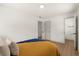 This bedroom offers hardwood-look floors and an en suite bathroom at 620 Plum Ln, Altamonte Springs, FL 32701