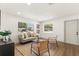 Inviting living room with an area rug, neutral-toned furniture, ample natural light, and modern fixtures at 620 Plum Ln, Altamonte Springs, FL 32701