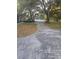 Spacious driveway with mature trees and large front yard at 6419 Lakeville Rd, Orlando, FL 32818