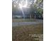 Charming two-story home with brick accents, a covered porch, and a well-maintained lawn at 6419 Lakeville Rd, Orlando, FL 32818