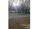 Charming home with a well-kept lawn and mature trees providing ample shade at 6419 Lakeville Rd, Orlando, FL 32818