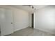 Neutral bedroom with fan, closet, and light grey flooring at 705 Wood Ln, Kissimmee, FL 34759