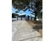 Charming home featuring a two-car garage, modern white exterior, and a spacious front yard at 705 Wood Ln, Kissimmee, FL 34759