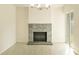 Living room with a decorative stone fireplace and light-colored floors at 705 Wood Ln, Kissimmee, FL 34759