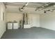 A spacious two car garage includes washer and dryer hookups and plenty of space at 705 Wood Ln, Kissimmee, FL 34759