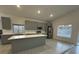Contemporary kitchen featuring gray cabinets, stainless appliances and ample counter space at 705 Wood Ln, Kissimmee, FL 34759