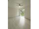 A sun filled living room contains a slider to the back yard and recessed lighting at 705 Wood Ln, Kissimmee, FL 34759